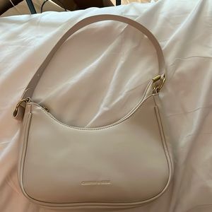 Small, white charfan and keqie Etsy brand shoulder bag